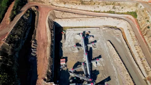 Top down aerial clip of a large open cast mine, quarry. Видео 236163400