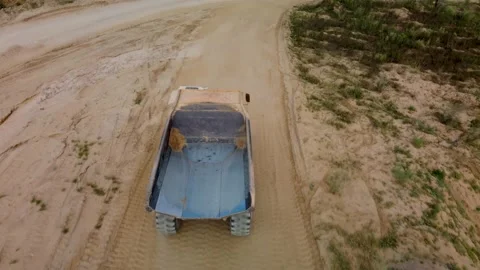 Top-down aerial close up view of empty quarry truck riding Stock Footage 170387799
