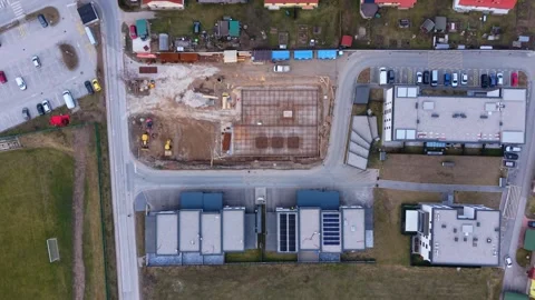 Top down aerial of construction site in town Stock Footage 330429243