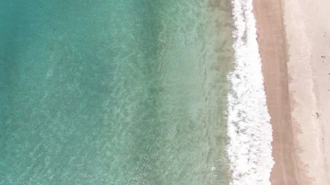 Top down aerial of crystal clear waters in Mercury bay, Coromandel Peninsula Stock Footage 104586670