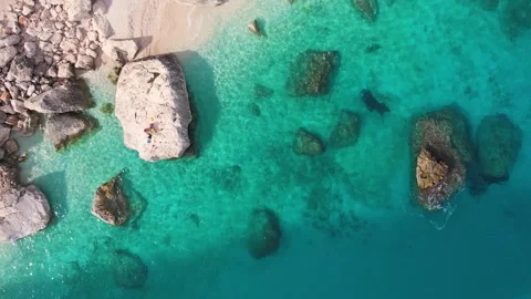 Top Down Aerial of Crystal Waters of Sardinia With Stunning Rocky Formations and Stock Footage 326969525