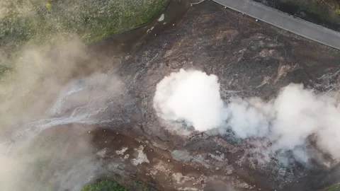Top-down aerial of a double eruption of great Geyser Strokkur in twilight Video stock 279686037