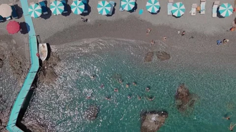 Top Down Aerial Drone Amalfi Beach Swimmers Umbrellas Turquoise Water Italy Stock-Footage 344990858