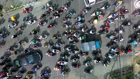 Top down aerial drone flight View of hundreds of bikers and dozens of cars Stock Footage 235350239