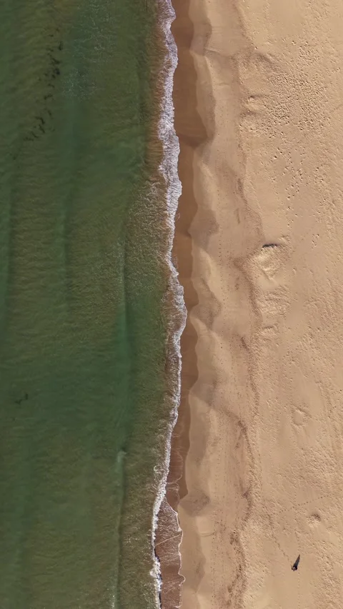 Top-down aerial drone footage of Sandbanks Beach in Poole, Dorset Stock Footage 336755989