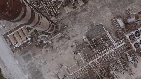 Top-down aerial drone shot of oil crisis devastated abandoned petrol gasoline Stock Footage 128188313