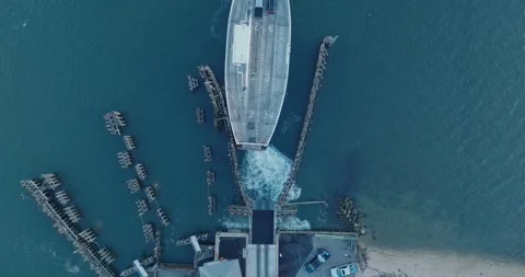 Top Down Aerial Drone shot of Shelter Island New York Ferry unloading at sunrise Stock Footage 255472523