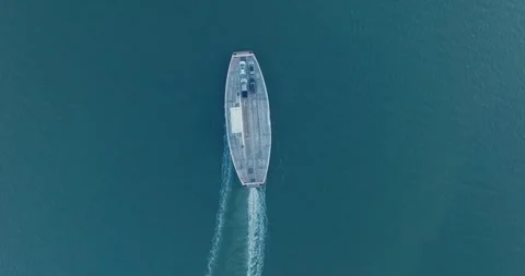 Top Down Aerial Drone shot of Shelter Island New York Ferry unloading at sunrise Stock Footage 255472630