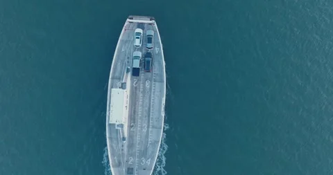Top Down Aerial Drone shot of Shelter Island New York Ferry unloading at sunrise Stock Footage 255472631
