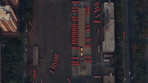 Top-Down Aerial Drone Shot of Crowded Mumbai Bus Stop with Multiple Red Buses Stock Footage 308092878