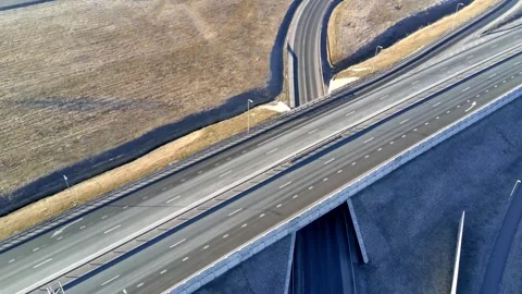 Top down aerial drone shot of highway bridge and road intersection Stock Footage 332012823