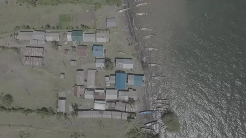Top down Aerial drone shot of a fishing village on the shores of Mfangano Видео 335164313