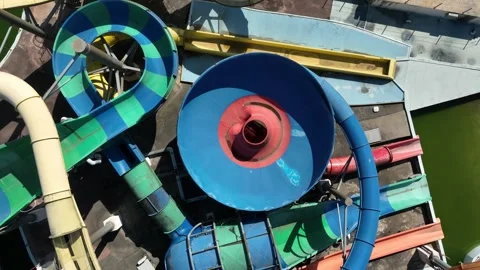 Top down aerial drone shot of colorful water slides and pools at aquapark. Stock Footage 336791747