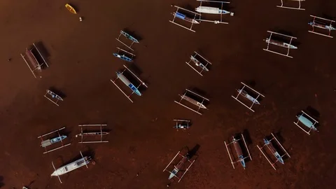 Top down aerial drone view at fishing boats at dirty bay, Bali, Indonesia, 4k Stock Footage 122585720