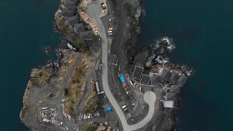 Top down aerial drone view of a seaside residential development located on an Stock Footage 124394848