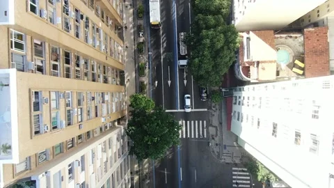 Top down aerial drone view flying forward over busy avenue in Copacabana Stock Footage 133938773