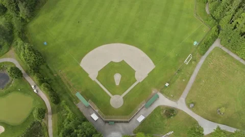 A top down aerial drone view of a green baseball field, baseball diamond, sports Видео 204101281