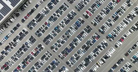 Top down aerial drone view on a large car park. Stockbeeldmateriaal 247321330
