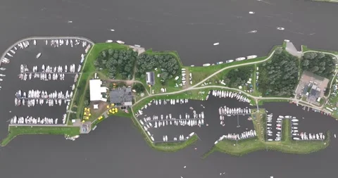 Top down aerial drone view on a sailing island in Friesland, The Netherlands. Stock Footage 249670459
