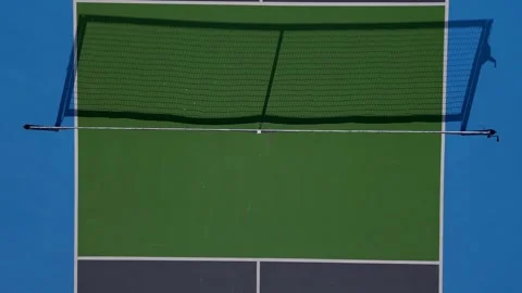 Top-down aerial drone view of pickleball courts with vibrant blue and green Video stock 289696021