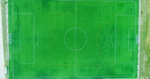 Top down aerial drone view of the centre of a football soccer pitch with pl.. Stock Footage 303931500
