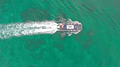 Top-Down Aerial Drone View of Boat Cruising Over Clear Turquoise Water Stock Footage 320850068