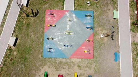 Top down aerial drone view of colorful playground and outdoor gym in Paragua 스톡 동영상 334692574