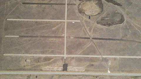Top-down aerial drone view of land markings and site preparation Stock Footage 337479369