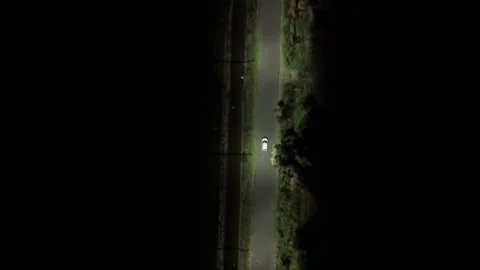 Top Down Aerial Drone View of White Car Driving on Rural Road Stock-Footage 338297737