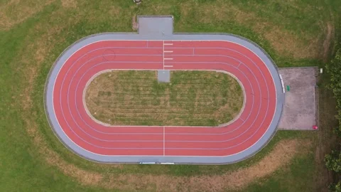 Top Down Aerial Drone View of Small Red Running Track Stock Footage 339971780