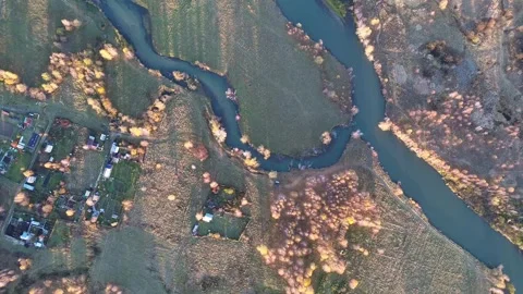 Top Down Aerial Drone View of a Meandering River Through Autumn Countryside Stock Footage 348246702