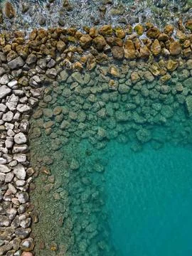 Top down aerial drone view of rock formations in the sea in Altea, Spain Stock Photos
