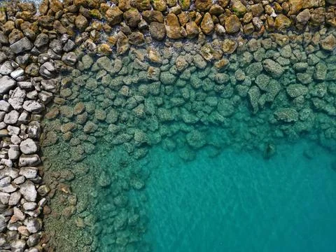 Top down aerial drone view of rock formations in the sea in Altea, Spain Stock Photos