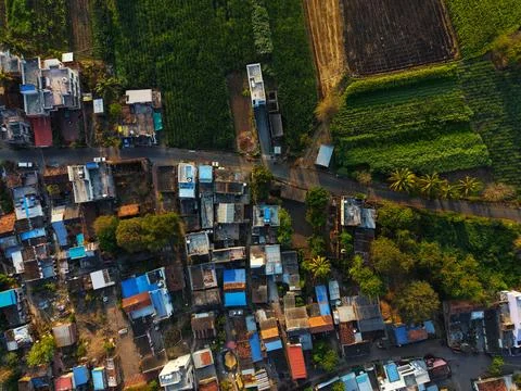 Top Down Aerial Drone View of Rural Indian Village Surrounded by Agricultural Fi Stock Photos