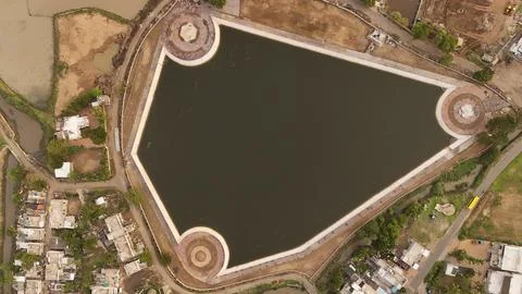 Top Down Aerial Drone View of Urban Lake Reservoir with Geometric Embankment Stock Photos