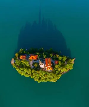 Top-Down Aerial Drone View of Bled Island and Church Shadow on Lake Bled 스톡 사진
