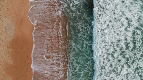 Top down aerial Elevating Drone Shot. Flying along the ocean coast. View of the Video stock 134325502