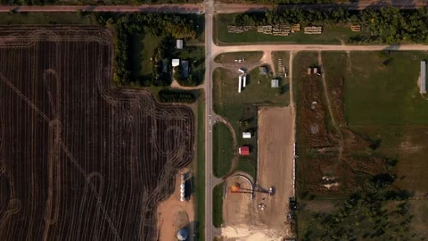 Top-down aerial of a farmstead and grain bins at the edge of Lebanon Video stock 345532068