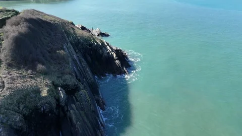 Top Down Aerial of Fishguard Coast and Calm Sea, Wales UK Stock-Footage 332075992