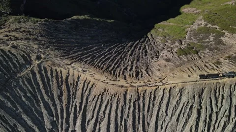 Top-Down Aerial Flight Along Volcanic Cliff at Mount Ijen, East Java Stock Footage 260043260