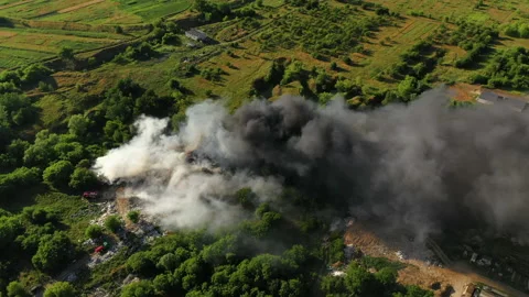Top down aerial flight at fire at garbage dump, 4k Stock Footage 136539653