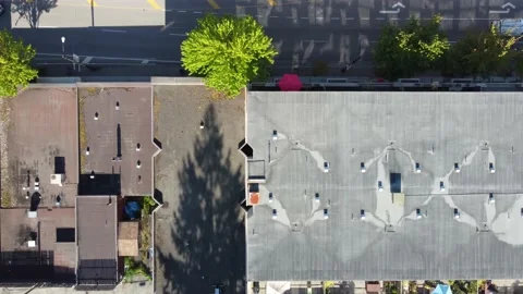 Top down aerial fly towards the roof in American city on a sunny day Stock Footage 154546027