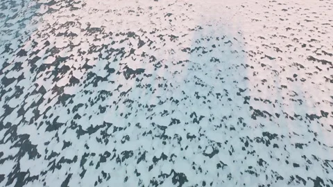 Top down aerial flying over frozen sea ocean covered in ice and snow Stock Footage 285845849