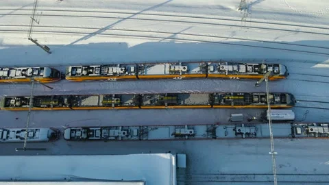 Top Down Aerial Glide Over Electric Train Depot Casting Long Winter Shadows Stock Footage 328591753