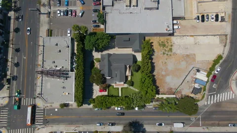 Top down aerial of a house between city streets in Los Angeles Stock Footage 345704064