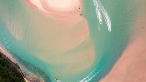 Top down aerial hyperlapse of holiday makers, swimming, paddling and jet ski Stock Footage 147377718