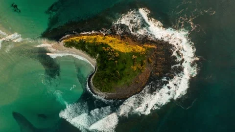 Top down aerial hyperlapse view of Green Island at sunrise with waves Stock Footage 157426279