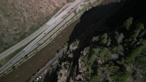 Top down aerial of interstate 70 through Glenwood Canyon Colorado next to river Stock Footage 274079236
