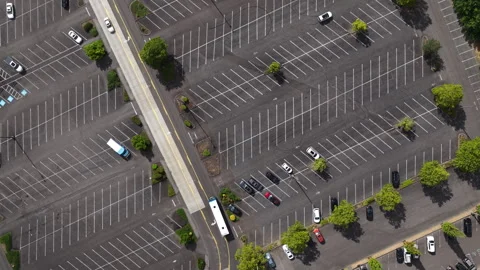 Top down aerial of large parking lot with parked cars and buses Stock-Footage 338357267