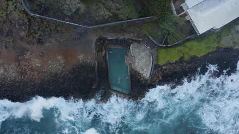 Top down aerial of man made private sea water swimming pool at the rocky coast Stock Footage 126605872